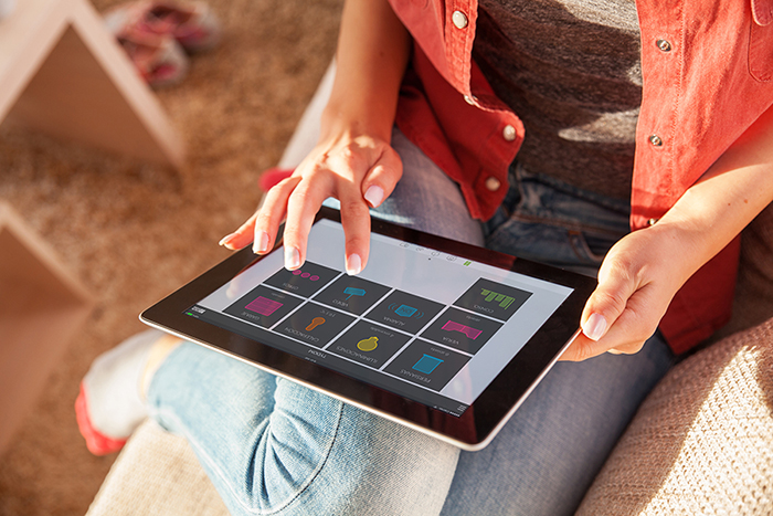 Woman using tablet.She touching the screen.